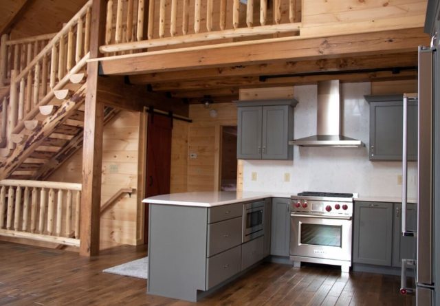 log cabin model home with open floor plan