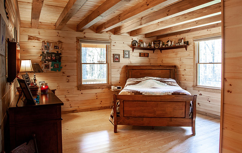 bedroom in two-story log cabin