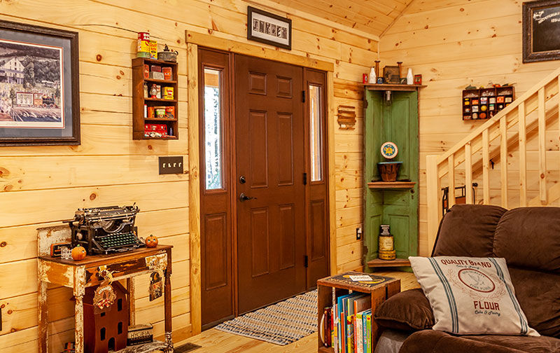 two-story log cabin entryway